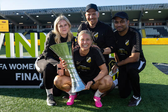 The physio staff of Häcken celebrate with the trophy