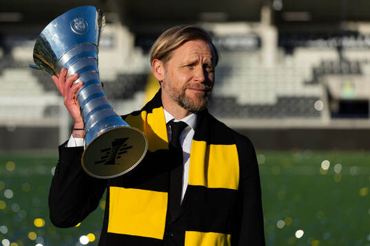 CEO Marcus Jodin of Häcken celebrates with the trophy