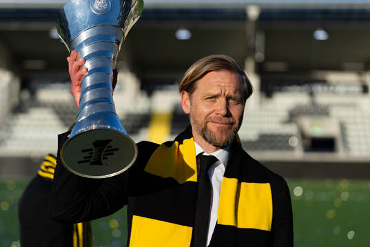 CEO Marcus Jodin of Häcken celebrates with the trophy