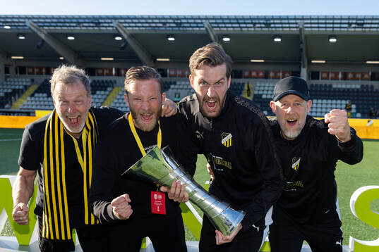 Staff of Häcken celebrate with the trophy