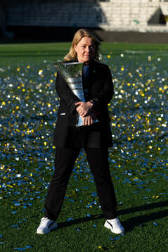 Press officer Linn Ohlsson poses with the trophy