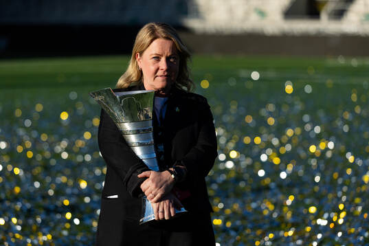 Press officer Linn Ohlsson poses with the trophy