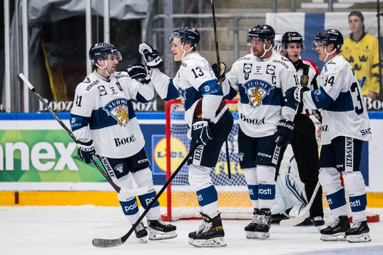 Jesse Puljujärvi and Ville Heinola of Finland celebrates