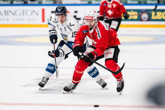Anton Lundell of Finland and Nico Hischier of Schweiz