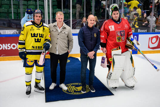 André Petersson of Sweden and goaltender Dominik Pavlat of