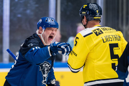 Esa Tikkanen of Finland Legends and Nicklas Lidström of