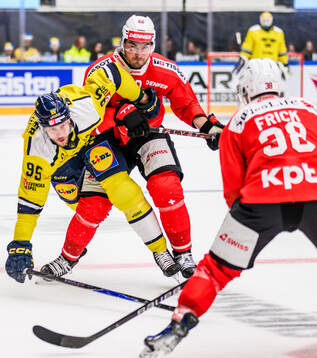 Jacob De La Rose of Sweden and Timo Meier of Switzerland