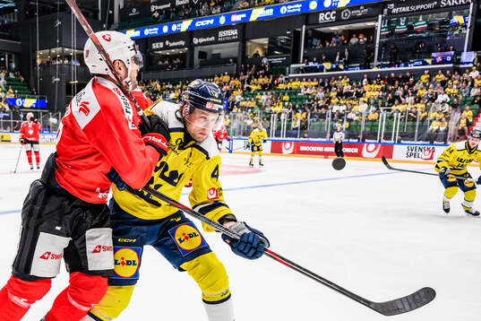 Timo Meier of Switzerland and Jacob Larsson of Sweden