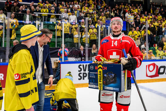 Dean Kukan of Switzerland is rewarded player of the match