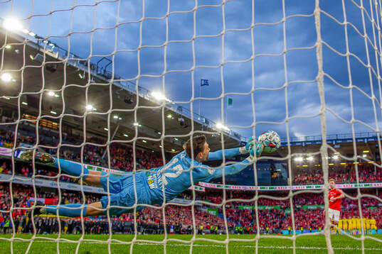 Goalkeeper Nikita Haikin of Bodø/Glimt saves the final