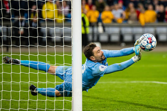 Goalkeeper Nikita Haikin of Bodø/Glimt saves the decisive