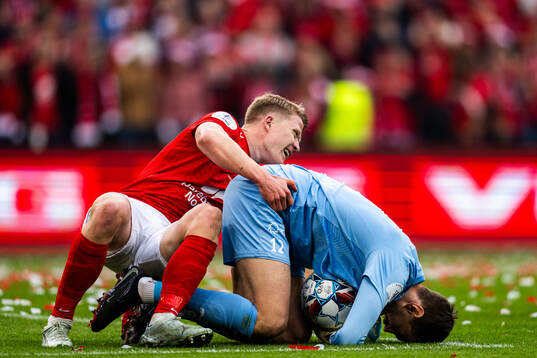 Kristian Eriksen of Brann and goalkeeper Nikita Haikin of