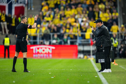 Head coach Freyr Alexandersson of Brann receive a yellow