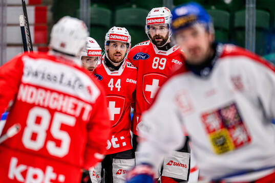 Denis Malgin, Pius Suter and Fabian Heldner of Switzerland