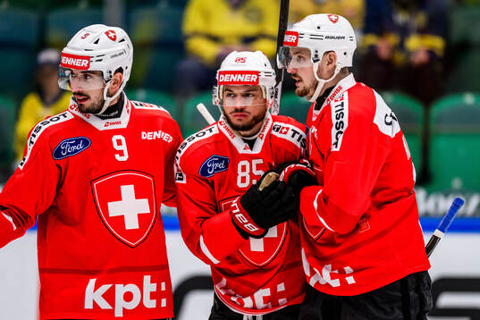 Damien Riat and Sven Andrighetto of Switzerland celebrates