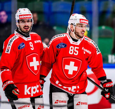 Damien Riat and Sven Andrighetto of Switzerland celebrates