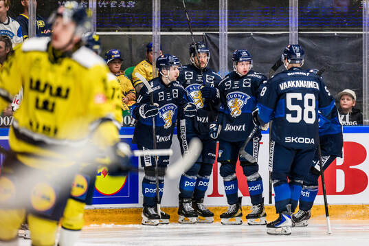 Ville Heinola, Alexander Barkov, and Aku Räty of Finland
