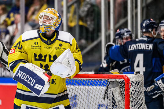 Goaltender Arvid Söderblom of Sweden looks dejected