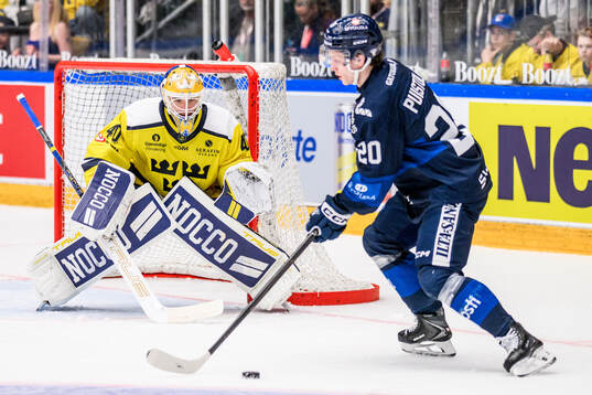 Goaltender Arvid Söderblom of Sweden and Patrik Puistola