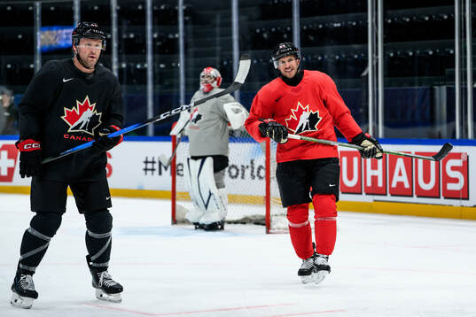 Morgan Reilly and Sidney Crosby of Canada at a practice