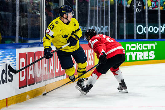 Lucas Raymond of Sweden and Dylan Demelo of Canada