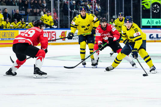 Parker Wotherspoon and Dylan Cozens of Canada and Simon