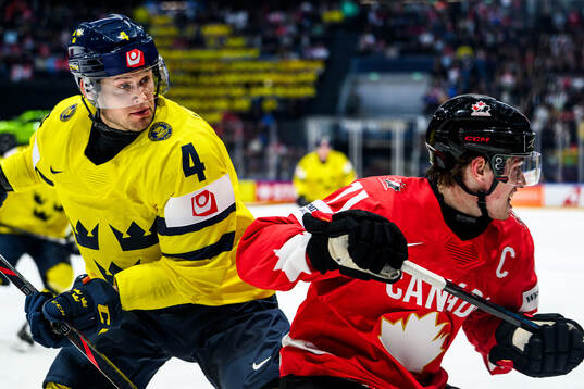 Jacob Larsson of Sweden and Macklin Celebrini of Canada