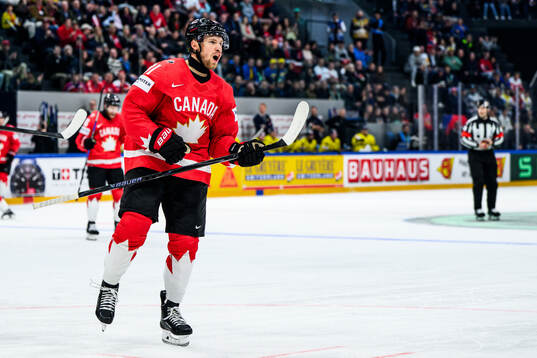 Dylan Holloway of Canada celebrates 3-2