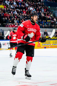 Dylan Holloway of Canada celebrates 3-2