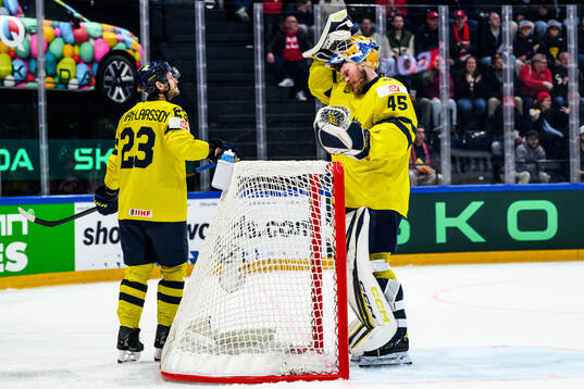 Oliver Ekman-Larsson and goaltender Magnus Hellberg of