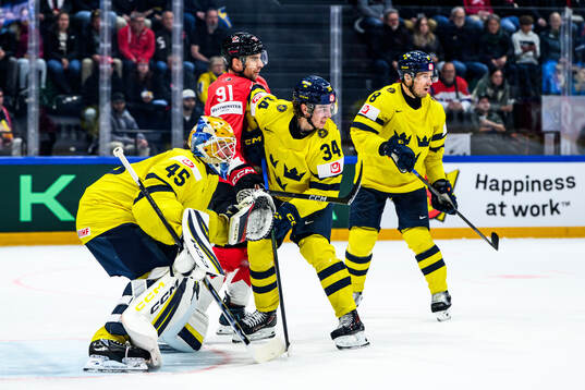 Goaltender Magnus Hellberg and Albert Johansson of Sweden