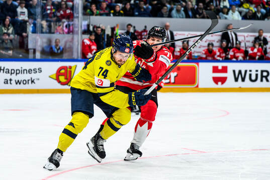 Rasmus Asplund of Sweden and Macklin Celebrini of Canada