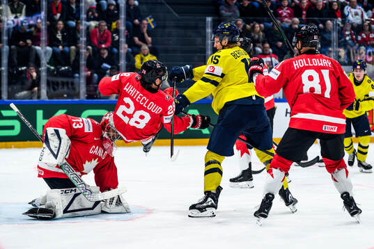 Jack Berglund of Sweden and Zach Whitecloud of Canada
