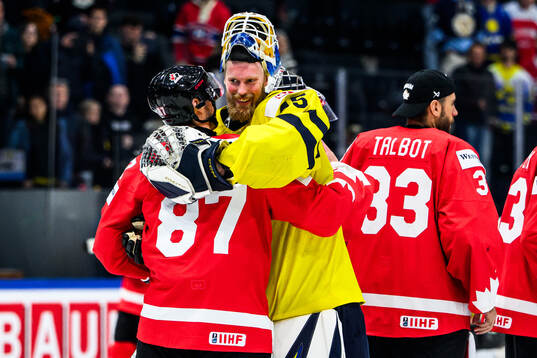Sidney Crosby of Canada and goaltender Magnus Hellberg of