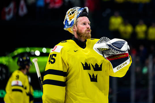 Goaltender Magnus Hellberg of Sweden looks dejected