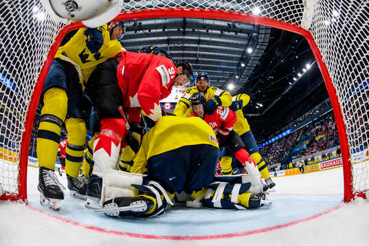 John Tavares and Dylan Cozens of Canada against Jacob De La