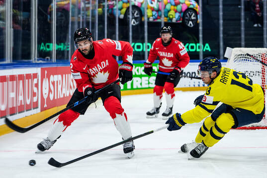 Dylan Demelo of Canada and Lucas Raymond of Sweden