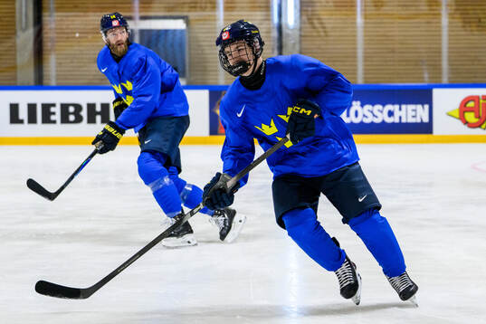 Mattias Ekholm and Viggo Björck of Sweden at a practice