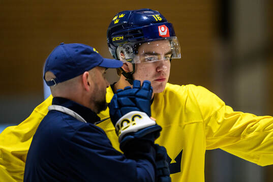 Assistant coach Anders Sörensen and Anton Frondell of