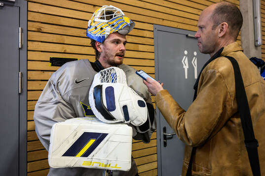 goaltender Arvid Söderblom of Sweden speaks to media