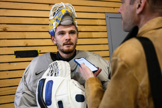 goaltender Arvid Söderblom of Sweden speaks to media
