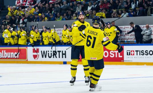 Mattias Ekholm and Viggo Björck of Sweden celebrate
