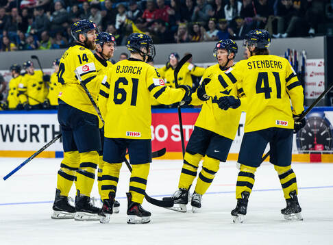 Mattias Ekholm of Sweden celebrates with Viggo Björck,