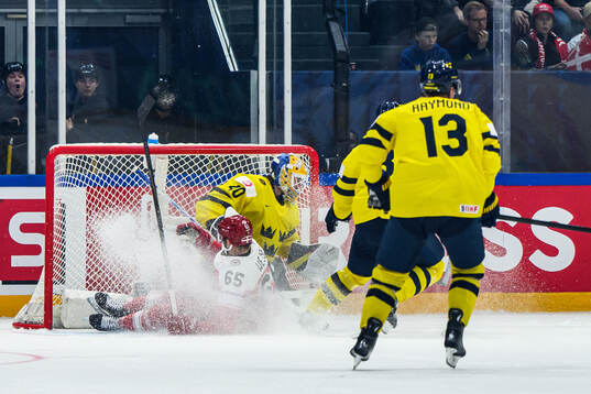 Christian Wejse of Denmark and goaltender Arvid Söderblom
