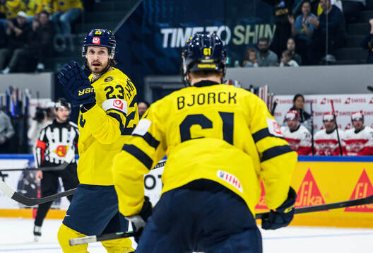 Oliver Ekman-Larsson of Sweden celebrates with Viggo Björck