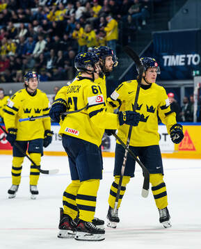 Oliver Ekman-Larsson of Sweden celebrates with Viggo