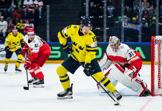 Jack Berglund of Sweden and goaltender Mads Søgaard of