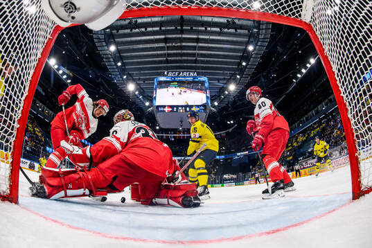 Malte Setkov, goaltender Mads Søgaard and Anders Koch of