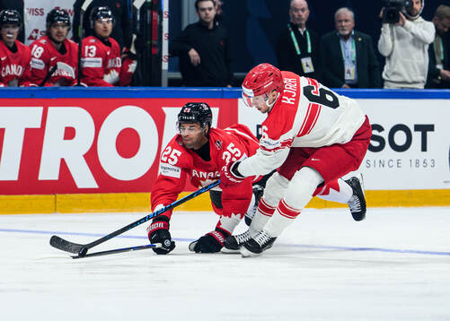 Darnell Nurse of Canada and Oliver Kjaer of Denmark