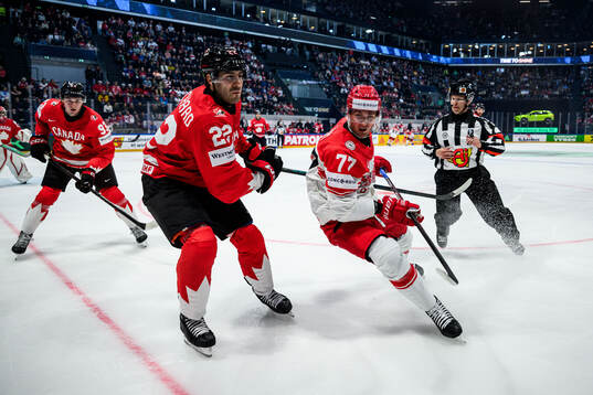 Evan Bouchard of Canada and Mathias From of Denmark